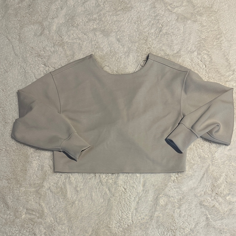 Twist back to front pullover